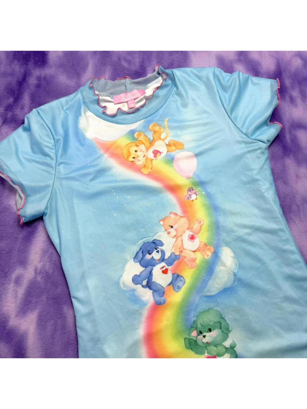 Dolls Kill x Care Bears blue mesh dress with rainbow and bears